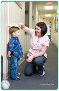 Nurse measuring child's height at Pediatric Associates of Alexandria